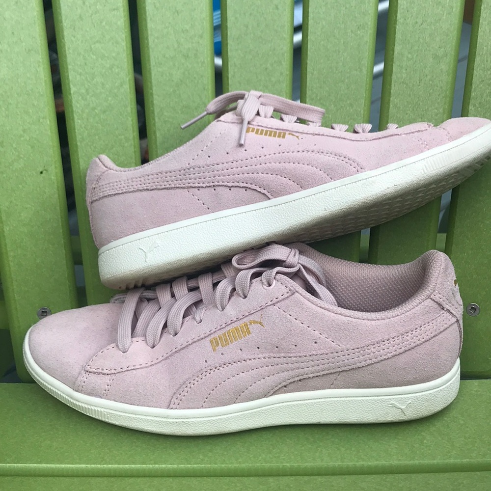 Lavender Puma sneakers.
